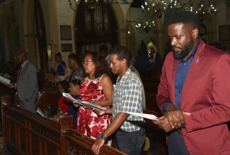 Assistant Registrar in the Independent Schools Branch, Ministry of Education, Skills, Youth and Information,  Andrew Pitkin (right), participates in the church service to mark Jamaica Independent Schools Association (JISA) Week, on Sunday (November 3) at St. Andrew Parish Church. JISA Week is being observed under the theme: ‘Innovative, Adapt, Lead: Shaping Tomorrow’s Learners Today’.

