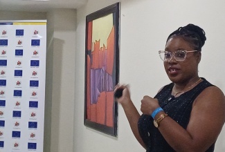 Regional Manager, Kingston, with the Jamaica AIDS Support for Life (JASL), Christina Gordon, addresses a training and development workshop for media professionals, held on November 28 at the Bahia Principe Grand Jamaica in Runaway Bay, St. Ann.