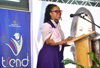 Permanent Secretary in the Ministry of Education, Skills, Youth and Information, Dr. Kasan Troupe, addresses the recent launch of the Transforming Education for National Development (TREND) portal at Clarendon College.
