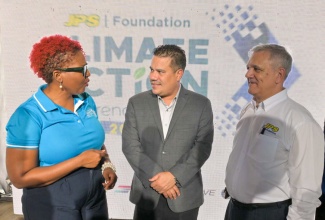 Minister without Portfolio in the Ministry of Economic Growth and Job Creation, Hon. Matthew Samuda (centre) shares in conversation with (from left) Head, Jamaica Public Service (JPS) Foundation, Sophia Lewis and Chairman, JPS Foundation, Damian Obiglio, at the Foundation’s inaugural Climate Action Conference and Expo held at the Chinese Benevolent Association in Kingston on November 30.