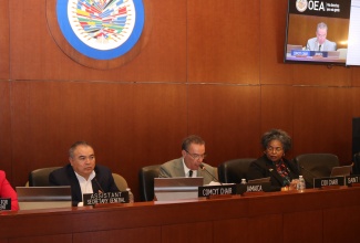 Minister of Science, Energy, Telecommunications and Transport, Hon. Daryl Vaz (centre), delivers opening remarks at the Seventh Meeting of Ministers and High-Level Authorities of Science and Technology at the Organization of American States (OAS) in Washington D.C., on December 12, 2024. Listening (from left) are: Executive Secretary of the Council for Integral Development of the OAS, Kim Osborne; OAS Assistant Secretary General, Ambassador Nestor Mendez; and Chair of the Inter-American Council for integral Development and Permanent Representative of St. Lucia,  Ambassador Elizabeth Darius- Clarke. Minister Vaz served as Chair of the Inter-American Committee on Science and Technology (COMCYT) for three years for the period 2021-2024.   The Republic of Peru was elected as the new Chair and Costa Rica as Vice Chair. 