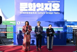 Jamaica’s non-resident Ambassador to South Korea, Her Excellency Shorna-Kay Richards (left) is joined by Secretary-General of the Korean Foundation for International Cultural Exchange, KIM Kyung-Nam (centre) and Philippine Ambassador, Her Excellency Maria Theresa Dizon-De Vega, in cutting the ribbon to open the 2024 Asia Song Festival X Culture Bridge Festa held recently at Yeouido Hangang Park in Seoul, South Korea.