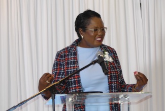 Acting Chief Education Officer, Terry-Ann Thomas-Gayle, delivers the keynote address at the Caribbean Examinations Council’s (CXC) annual staff appreciation and awards luncheon held on Friday (Dec. 13), at the ROK Hotel in downtown Kingston.