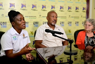 Technical Manager for the Soil Health, Plant Tissue and Water Laboratory in the Ministry of Agriculture, Fisheries and Mining’s Agriculture Land Management Division (ALMD), Pamella McKenzie (left), speaks during a Jamaica Information Service (JIS) ‘Think Tank’ at the agency’s head office in Kingston on Thursday (December 12). Listening are: Senior Lecturer at the College of Agriculture, Science and Education (CASE), Spencer Jarrett, and Soil Food Web Consultant, Lise Charron Alexander.

