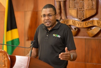 Minister without Portfolio in the Ministry of Economic Growth and Job Creation with Responsibility for Works,  Hon. Robert Morgan, addressing Tuesday’s (December 11) post-Cabinet press briefing at Jamaica House.