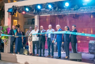 Prime Minister, Dr. the Most Hon. Andrew Holness (fourth right), is joined by Tourism Minister, Hon. Edmund Bartlett (centre), Mayor of Lucea, Councillor Sheridan Samuels (third from left), Managing Director, Princess Hotels and Resorts, Enrico Pezzoli (third right), and other stakeholders in cutting the ribbon to mark the official opening of Princess Grand Jamaica and Princess Senses The Mangrove Resorts in Green Island, Hanover, on Thursday (December 12).

