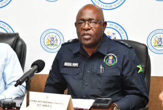 Acting Assistant Commissioner of Police in charge of Area 4, Michael Phipps, addresses a press conference at the Kingston and St. Andrew Municipal Corporation’s Church Street offices in downtown Kingston, recently.

