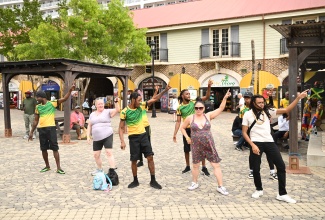 Visitors learn popular dance steps from local entertainers at the Falmouth Pier in Trelawny. The visitors arrived aboard the Disney Treasure vessel, which made it inaugural call to Falmouth on Thursday (December 5).

