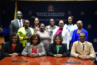 Minister of Education, Skills, Youth and Information (MOEYI), Senator Dr. the Hon. Dana Morris Dixon (second right, seated), shares a moment with finalists in the LASCO/ MOEYI/Jamaica Teaching Council (JTC) Teacher, Technical Vocational Education and Training (TVET) Teacher and Principal of the Year Awards, at the Ministry’s National Heroes Circle offices in Kingston on Tuesday (December 3). Others in the front row (from left) are Chief Executive Officer (CEO) of the LASCO Chin Foundation, Professor Rosalea Hamilton; CEO of the JTC, Dr. Winsome Gordon; and President of the JTC, Dr. Joseph Thomas.

