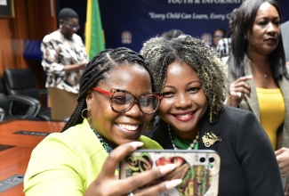 Minister of Education, Skills, Youth and Information, Senator Dr. the Hon. Dana Morris Dixon (left) shares a selfie with Technical Vocational Education and Training (TVET) teacher at Bridgeport High School in Portmore, St. Catherine, Shaneil Davis. Occasion was a courtesy call by finalists in the LASCO/MOEYI/Jamaica Teaching Council (JTC) Teacher, Technical Vocational Education and Training (TVET) Teacher and Principal of the Year Awards at the Ministry’s National Heroes Circle offices in Kingston on Tuesday (December 3).

