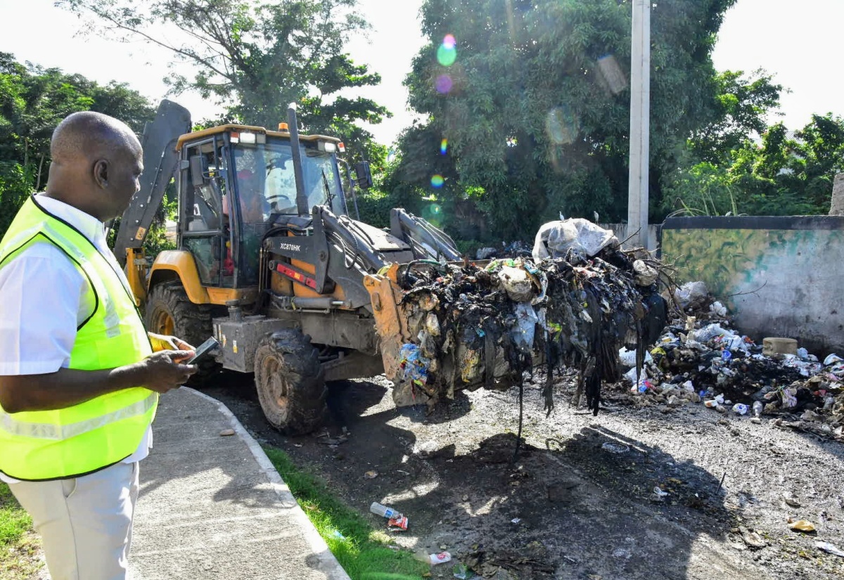 PHOTOS: NSWMA Clears Mini Dump Downtown Kingston