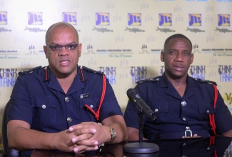 Deputy Commissioner at the Jamaica Fire Brigade (JFB) Sean Martin (right), listens as Superintendent, JFB, Emeleo Ebanks, speaks at a Jamaica Information Service (JIS) Think Tank, on December 10, at the Agency’s head office in Kingston.

