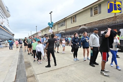 Cruise passengers enjoy activities and offerings during the ‘Disney Treasure’s’ inaugural visit to the Port of Falmouth in Trelawny on December 5.