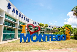 The bold and colourful 'I Love Montego Bay' sign at the entrance of the Sangster International Airport (SIA) in Montego Bay.  