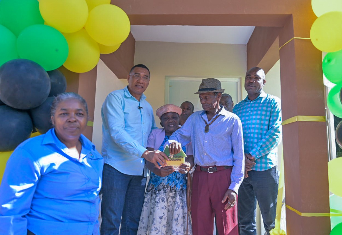 Prime Minister, Dr. the Most Hon. Andrew Holness (second left) , hands New Social Housing Programme (NSHP) beneficiaries Shirley ( third  left) and Calvin Swaby (second right) the keys to their new home in Fullerton Park, St. Ann on Thursday ( Dec. 12). Sharing in the moment are (from left) Chairperson of the NSHP Oversight Committee, Judith Robb Walters, and Minister of State in the Ministry of Finance and the Public Service and Member of Parliament for St. Ann South West , Hon. Zavia Mayne (right).