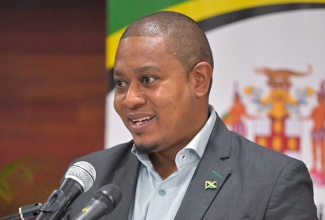 Minister of Agriculture, Fisheries and Mining, Hon. Floyd Green, addresses a press conference at the Ministry, in St. Andrew, on December 18.