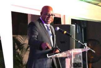 Minister of Tourism, Hon. Edmund Bartlett, addresses a forum on Artificial Intelligence (AI) in tourism at Sandals Royal Plantation in Ocho Rios, St. Ann on Friday (Dec.13).