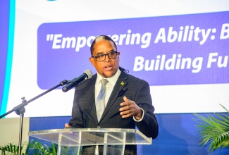 State Minister in the Ministry of Labour and Social Security, Dr. the Hon. Norman Dunn, addresses the HEART/NSTA Trust Disabilities Awareness Conference, held recently at the Jamaica Conference Centre in downtown Kingston.

