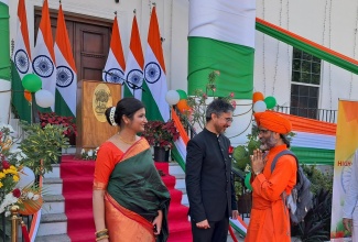 High Commissioner of India to Jamaica, His Excellency Mayank Joshi (centre) and his wife, Isha Joshi (left), with Principal of Ananda Marga Kinder-Prep, Acarya Giitisudhananda, at the 75th India Republic Day celebration, held on January 26 at India House, 2 East King’s House Road in Kingston.

