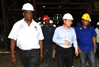 Minister of Agriculture, Fisheries and Mining, Hon. Floyd Green (right); State Minister in the Ministry, Hon. Franklin Witter (left); and Pan Caribbean