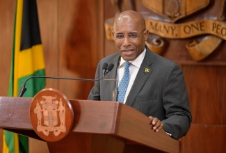 Minister of Industry, Investment and Commerce, Senator the Hon. Aubyn Hill, addresses Wednesday’s (January 15) post-Cabinet press briefing at Jamaica House.

