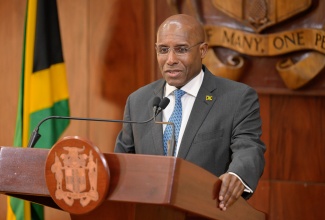 Minister of Industry, Investment and Commerce, Senator the Hon. Aubyn Hill, addresses Wednesday’s (January 15) post-Cabinet press briefing at Jamaica House.

