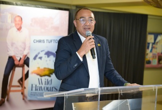 Minister of Health and Wellness, Dr. the Hon. Christopher Tufton, addresses the official launch of his latest book, ‘Wild Flavours’, at the Undercroft, University of the West Indies, Mona, St. Andrew, on January 21.

