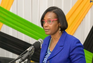  Acting Permanent Secretary in the Ministry of Labour and Social Security, Dione Jennings, addresses the send-off ceremony for 96 farm workers who departed Jamaica for Canada under the Seasonal Agricultural Workers Programme (SAWP). The ceremony was held on Friday (Jan. 3) at the Ministry’s Overseas Employment Centre in Kingston.