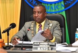 Mayor of Kingston, Councillor Andrew Swaby,  reviews his notes during today’s (January 14) meeting of the Kingston and St. Andrew Municipal Corporation (KSAMC) at the Corporation’s offices in downtown Kingston.

