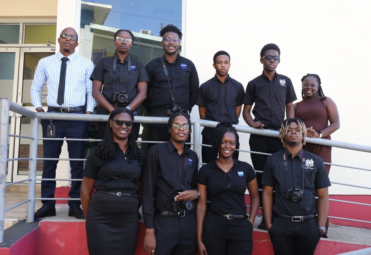 Television Production Assistant, Jamaica Information Service (JIS), Aleisha Miller (back row, right), shares a photo opportunity with students and staff of the HEART/NSTA Trust Newport Campus in Manchester, during a tour of the JIS Television offices in Kingston on Tuesday (January 14). In back row (from left) are HEART/NSTA Trust Multimedia Production Instructor, André Adams; and students Genel Parker, Giovanni Roye, Matthew Simpson, and Jordan Whitely. In from row (from left) are Kaylia Rose, Rahiene Thompson, Asha Wisdom, and Tajay Stewart. The students also visited the JIS headquarters on Half-Way Tree Road on the day.

