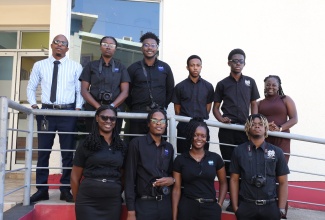 Television Production Assistant, Jamaica Information Service (JIS), Aleisha Miller (back row, right), shares a photo opportunity with students and staff of the HEART/NSTA Trust Newport Campus in Manchester, during a tour of the JIS Television offices in Kingston on Tuesday (January 14). In back row (from left) are HEART/NSTA Trust Multimedia Production Instructor, André Adams; and students Genel Parker, Giovanni Roye, Matthew Simpson, and Jordan Whitely. In from row (from left) are Kaylia Rose, Rahiene Thompson, Asha Wisdom, and Tajay Stewart. The students also visited the JIS headquarters on Half-Way Tree Road on the day.

