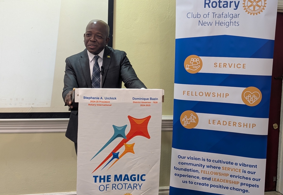 Minister of Labour and Social Security, Hon. Pearnel Charles, Jr., addresses the recent general meeting of the Rotary Club of Trafalgar New Heights in Kingston. The meeting was held at The Summit.