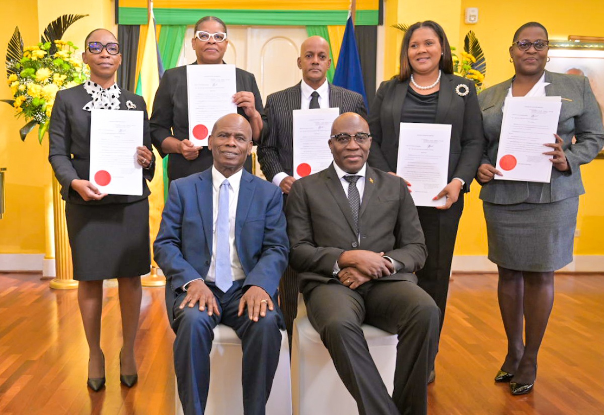 Deputy Governor-General, Hon. Steadman Fuller (seated left), and Chief Justice, Hon. Bryan Sykes (seated right), with members of the judiciary who were sworn in to higher offices,  today (January 6), at King’s House. They are (from left) Her Honour Tracey Ann Johnson; Justice Georgiana Fraser; Justice Kissock Laing; Her Honour Christine McNeil and Her Honour Opal Smith.

