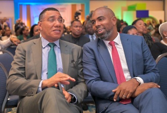 Prime Minister, Dr. the Most Hon. Andrew Holness, converses with Chairman of the Jamaica Stock Exchange (JSE), Steven Whittingham, at the JSE Investments & Capital Markets Conference held at The Jamaica Pegasus hotel in New Kingston on Tuesday (January 21). 