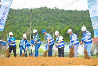 Prime Minister, Dr. the Most Andrew Holness (centre), breaks ground for the White Hall to New Market Water Supply Project in St. Elizabeth on Friday ( February 7). Also breaking ground are (from left) National Water Commission (NWC) St. Elizabeth and Manchester Regional Manager, Jermaine Jackson; St. Elizabeth Municipal Corporation Chairman and Mayor of Black River, Councillor Richard Solomon;  Minister of State in the Ministry of Science, Energy, Telecommunications and Transport and Member of Parliament for St. Elizabeth North Eastern, Hon. J.C. Hutchinson; Minister without Portfolio in the Ministry of Economic Growth and Job Creation, Hon. Matthew Samuda, and NWC Acting President, Kevin Kerr, and Project Manager, Timmy Daley.