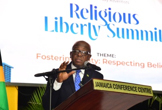 Minister of Labour and Social Security, Hon. Pearnel Charles Jr. , addressing the Religious Liberty Summit, held at the Jamaica Conference centre, downtown Kingston, recently.

