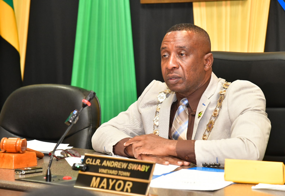Mayor of Kingston, Councillor Andrew Swaby, addresses a recent meeting of the Kingston and St. Andrew Municipal Corporation (KSAMC), at the Corporation