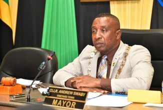 Mayor of Kingston, Councillor Andrew Swaby, addresses Tuesday’s (February 12) sitting of the Kingston and St. Andrew Municipal Corporation (KSAMC) monthly meeting. The meeting was held at the KSAMC’s offices in downtown Kingston. 

