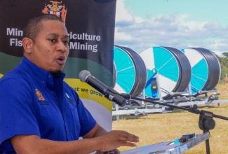 Agriculture, Fisheries and Mining Minister, Hon. Floyd Green, addresses the handover ceremony of seven irrigation travellers to the Bodles Agriculture Research Station at the facility in in St. Catherine on Wednesday (January 29).