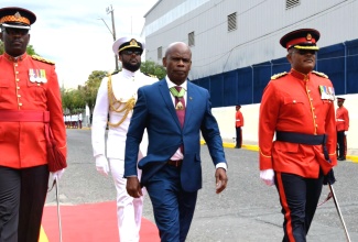 Custos of Kingston, Hon. Steadman Fuller (centre), who deputised for Governor-General, His Excellency the Most Hon. Sir Patrick Allen, arrives at Gordon House on Thursday (February 13) to deliver the Throne Speech at the ceremonial opening of Parliament.