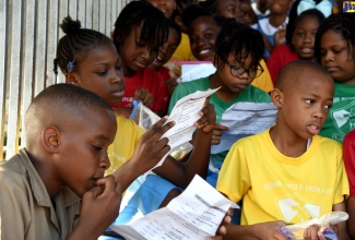 Students from Jessie Ripoll Primary School in Kingston look over the schedule for the Primary Exit Profile (PEP) tests.

