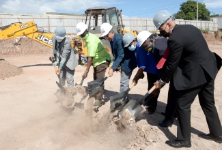 Deputy Prime Minister and Minister of National Security, Hon. Dr. Horace Chang (third left), breaks ground for construction of a state-of-the-art forensic pathology autopsy suite at 149 Orange Street, downtown Kingston, on November 12, 2021. Joining the Minister (from left) are former Mayor of Kingston, Councillor Delroy Williams;  Minister of Local Government and Community Development, Hon. Desmond McKenzie; Executive Director, Institute of Forensic Science and Legal Medicine, Dr. Judith Mowatt; former Permanent Secretary in the Ministry of National Security, Courtney Williams; and former Commissioner of Police, Major General Antony Anderson.

