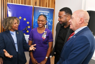 Minister of Education, Skills, Youth and Information, Senator Dr. the Hon. Dana Morris Dixon (left), interacts with participants during Wednesday’s (February 19) launch of the European Union (EU)-Universal Service Fund (USF) student video competition at the EU Delegation Office in Kingston. Sharing the conversation (from second left) are President, St. Hilda’s Diocesan High School’s Information and Communications Technology (ICT) Club, Deiandra Underhill; Chief Executive Officer, USF, Charlton McFarlane; and Head of Cooperation for the EU Delegation, Aniceto Rodríguez Ruiz.

