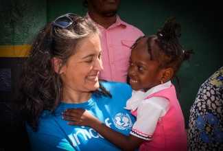 Education Specialist at United Nations Children Fund (UNICEF) Jamaica, Dr. Rebecca Tortello, smiles with a student from the Edward Seaga Primary School during a Play Day Ja event at Water Lane in downtown Kingston on Wednesday, February 5, in recognition of Global School Play Day.

