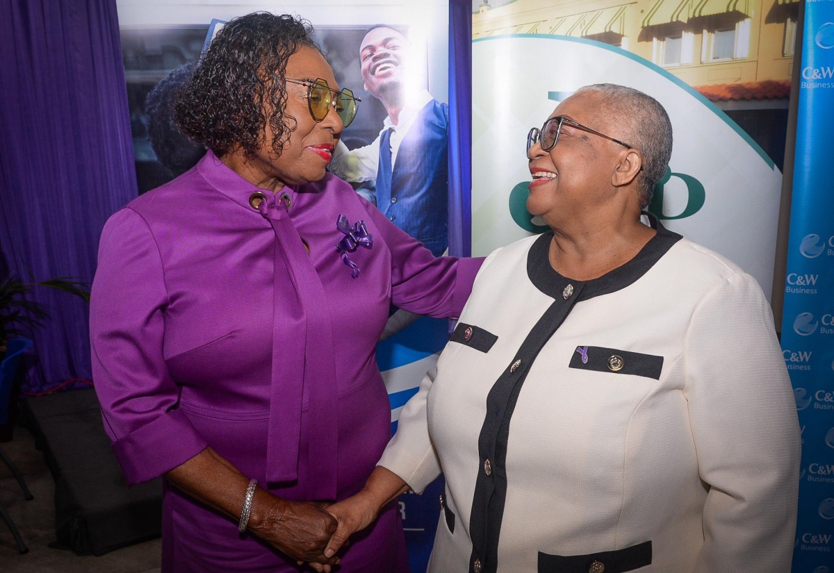 Culture, Gender, Entertainment and Sport Minister, Hon. Olivia Grange (left), greets Managing Director of the Jamaica Stock Exchange (JSE), Dr. Marlene Street Forrest, at the JSE’s ‘Ring the Bell for Gender Equality For All Women and Girls: Rights, Equality, Empowerment’ event, held on Monday (March 10) at the JSE offices in downtown Kingston.

