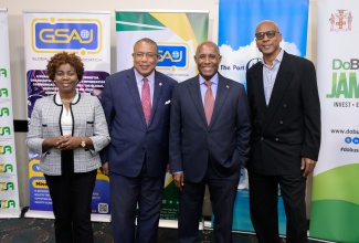 Minister of Industry, Investment and Commerce, Senator the Hon. Aubyn Hill (second right), poses for a photo opportunity with (from left) Vice President, Business Process Outsourcing (BPO) and Logistics, Port Authority of Jamaica (PAJ), Gloria Henry; Opposition Spokesperson on Investment, Trade and Global Logistics, Anthony Hylton, and President, Global Services Association of Jamaica (GSAJ), Wayne Sinclair, during the recent media launch for the GSAJ’s upcoming ‘Outsource to Jamaica’ (O2J) Conference, at the Jamaica Pegasus Hotel in New Kingston.