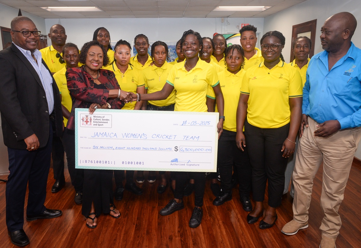 Minister of Culture, Gender, Entertainment and Sport, Hon. Olivia Grange (second left, front), presents an incentive cheque for $6.8 million to Captain of the Jamaica Senior Women’s Cricket Team, Rashada Williams (third right, front), at the Ministry’s office in Kingston on Friday, March 14. Each player will receive $400,000, while each member of the management team will receive $200,000. Joining the team are officials from the Jamaica Cricket Association.

