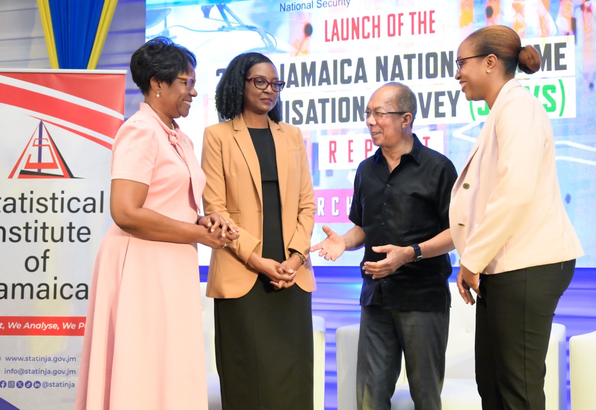 Minister of National Security, Hon. Dr. Horace Chang (second right), engages in conversation with (from left) Permanent Secretary in the Ministry, Ambassador Alison Stone Roofe; Director of the Surveys Division, Statistical Institute of Jamaica (STATIN), Dr. Natalee Simpson; and Acting Director General, STATIN, Leesha Delatie-Budair at the launch of the 2023 Jamaica National Crime Victimisation Survey (JNCVS). The JNCVS launch was held at the AC Marriott Hotel in Kingston today (March 28).