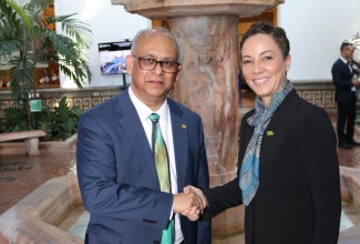 Minister of Foreign Affairs and Foreign Trade, Senator the Hon. Kamina Johnson Smith, congratulates Minister of Foreign Affairs, International Business and International Cooperation, Suriname, His Excellency Albert Ramdin, on his historic election as the new Secretary General of the Organization of American States (OAS) on Monday, March 10, during the 56th Special Session of the General Assembly of the OAS at its headquarters in Washington, D.C.