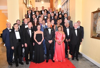 Their Excellencies, Governor-General the Most Hon. Sir Patrick Allen (front, third right) and Lady Allen (front, second right); and Minister of Foreign Affairs and Foreign Trade, Senator the Hon. Kamina Johnson Smith (front, third left), are surrounded by members of the diplomatic community at the annual Diplomatic Corps Dinner held recently at King's House. The event was part of several activities in observance of Diplomatic Week 2025, from March 10 to 14 under the theme: ‘Building Partnerships for Sustainable Development’.  Diplomatic Week aims to promote collaboration on key issues, including economic growth, trade, climate resilience and cultural exchange.